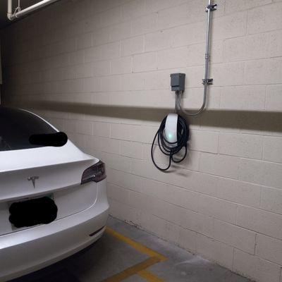 Tesla Charger installed in the designated parking, HOA Approved