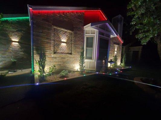 Landscaping lights, up lights, string LED lights and sconce lights installed in a single family home.