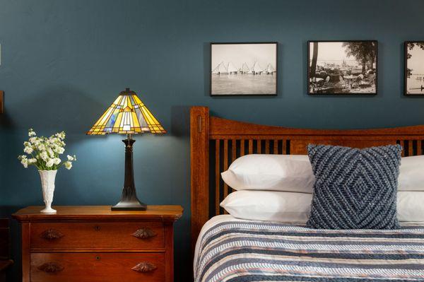 Mendota Suite bed and historic wall photos