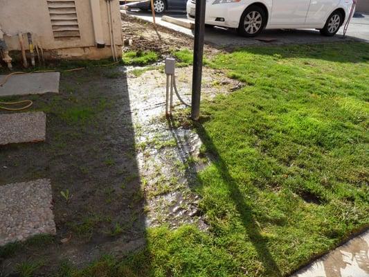 Underground water damage coming up from underneath the buildings. Electrical cords and water? Safety hazards.