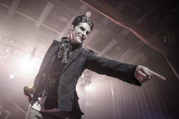 Perry Farrell frontman of Jane's Addiction wearing CLADE tailcoat and vest onstage
  Image by Todd Owyoung