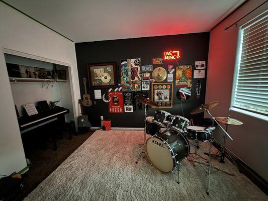 My newly painted Music room with Tama kit and new Evans drum head and sticks. Julie A