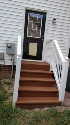 We washed and stained the porch. Also painted the door