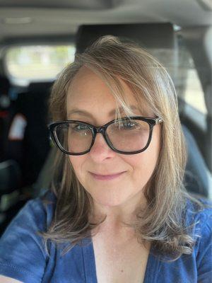 Me, happily taking a post haircut selfie in my car, still sitting in the parking lot.