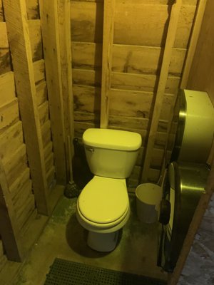 Toilet in shower house/bathroom