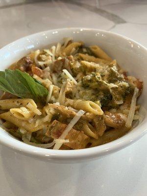 Creamy Sriracha chicken pasta with roasted vegetables. A crowd favorite!