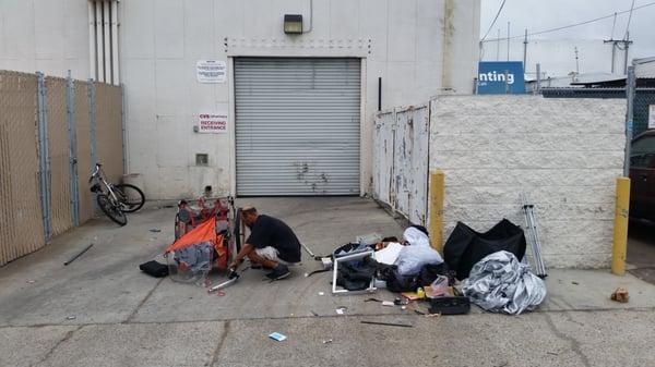 Homeless and more trash in their alley.