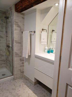 Bathroom remodel with custom inset vanity, mirror and lighting