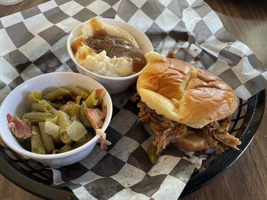 BBQ sandwich, green beans, and mashed potatoes and gravy