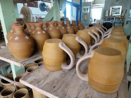 Greenware drying racks for the Big Texas Independence Mugs and Salad Oil Bottles featured in "Texas Highways" Magazine.