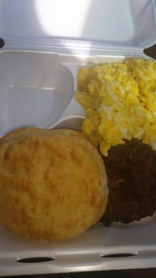 Scrambled eggs, sausage and a biscuit