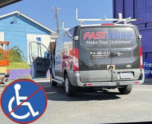 Fast Signs van parked at angle blocking 2 parking spaces. One of which was for handicap parking only.  What a dick move!