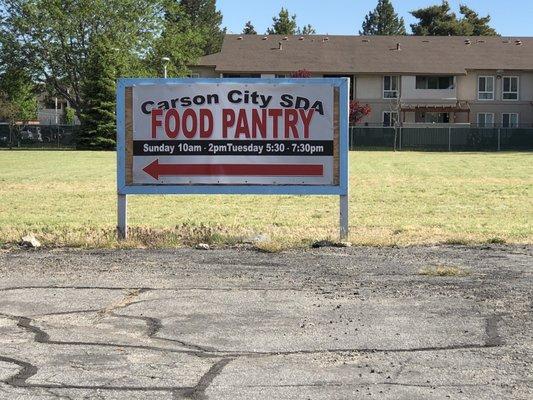 Tuesday, May 26, 2020: sign for food pantry in parking lot.