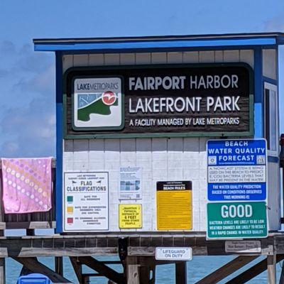 Fairport Harbor Lakefront Park Sign and notice water condition sign.