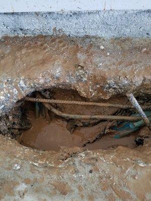 Termite man drilled through water line in garage.