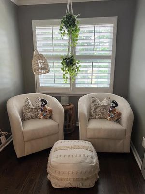 Recently cleaned nook style sitting room with two love seats side by side and an ottoman...