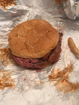 Roast beef in a onion roll.  Those aren't onions. They are sesame seeds.  It's a large beef.  Not a super beef.