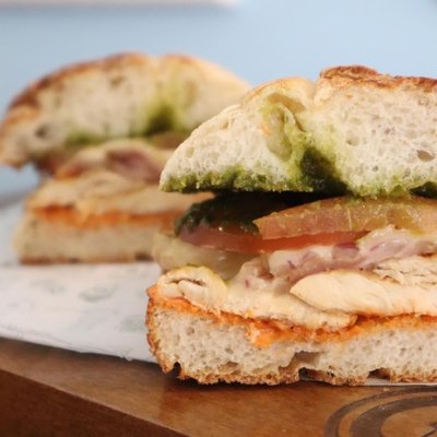 Ciabatta bread with grilled chicken breast, pesto sauce, cheese and sun dried tomato dressing.