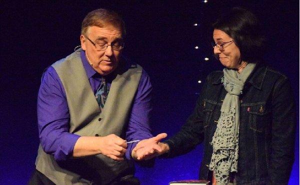 Phoenix magician, Rod Robison, performs his show Mentallusions, with audience member on stage.