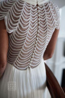 A gorgeous bride in a beautifully detailed dress.