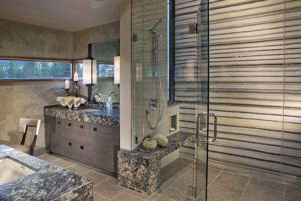 custom slab shower, bench, and vanities