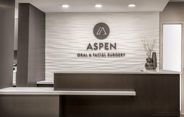 Reception Desk at AOFS with Signage Wall