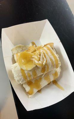 Half of banana pudding and wafers rolled ice cream.