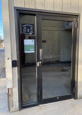 Elevator entrance is through this glass door.