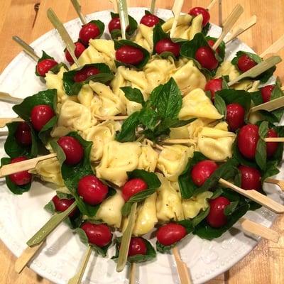 Lemon marinated tortellini skewers with tomato and basil