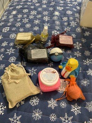 Bar soap, bug spray, salt scrub, bath bombs, rubber ducky.