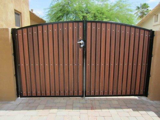 Arched custom RV gate with synthetic pickets and custom latch.