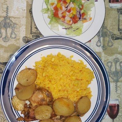 Yellow rice mix with corn,  roasted lime chicken with potatoes.