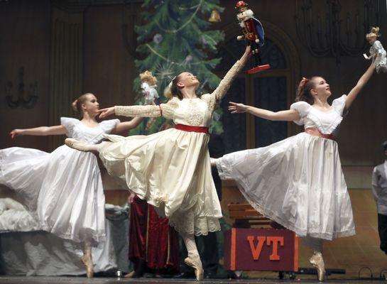 Clara and her friends dance with their presents from the mysterious Dr. Drosselmeyer.