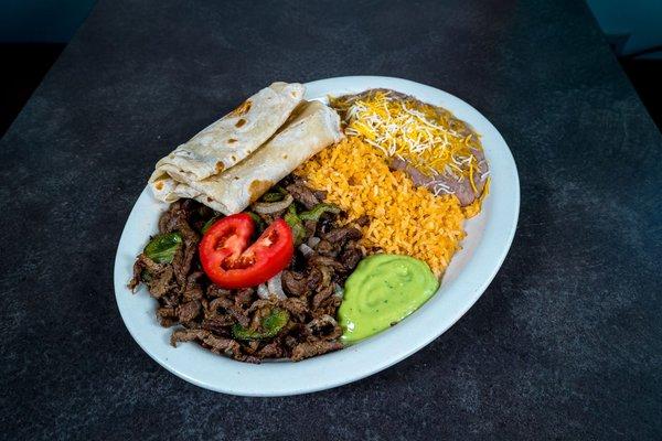 #5 Fajitas Plate: Your choice of Beef or Chicken Fajitas, cooked with bell peppers, onions and tomatoes. Served with beans and rice.