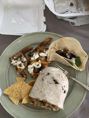 Steak Fries, Steak Street Tacos, and 1/2 of Chicken Burrito.  Chips are mine; I did not eat as I couldn't finish Marty's cuisine.