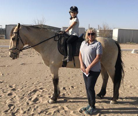 Owner and dressage instructor Jan with my daughter on one of their lesson horses