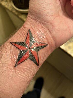 Star on both Wrist Tattoos.