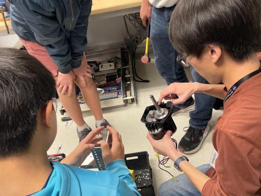 JPL mentor shows team gears in a motor