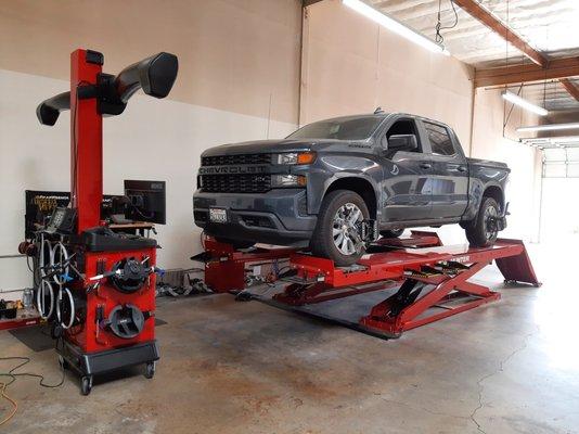 Chevrolet Silverado in for factory alignment, including camber and caster adjustment if needed.