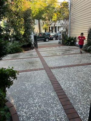 Tabby concrete driveway with paver borders