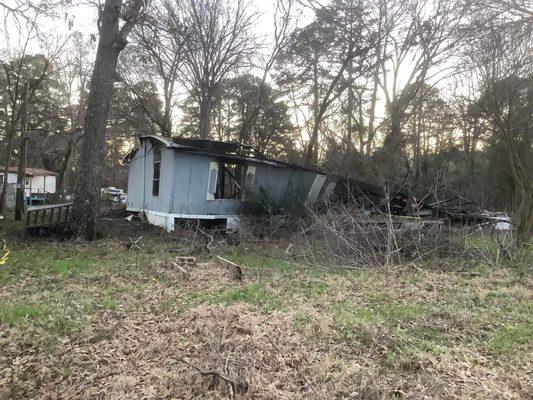 A home, 70% burned down, and NO indication of a policy to deal with these unsightly blights to our community