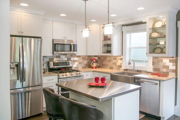 Stunning painted white cabinetry with stainless steel and aluminum accents.