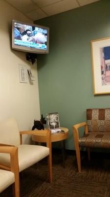 Several little waiting areas within a large waiting room