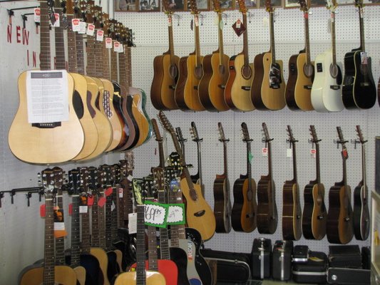 All types of Guitars at Killough's Music.  Come in and play.