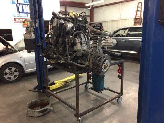 Volkswagen Touareg engine pulled out of the vehicle for timing chain repair.