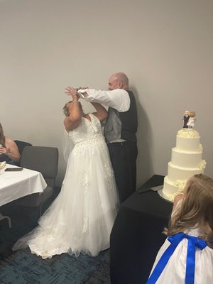 Every groom just HAS to force feed his bride on their wedding day, right ?