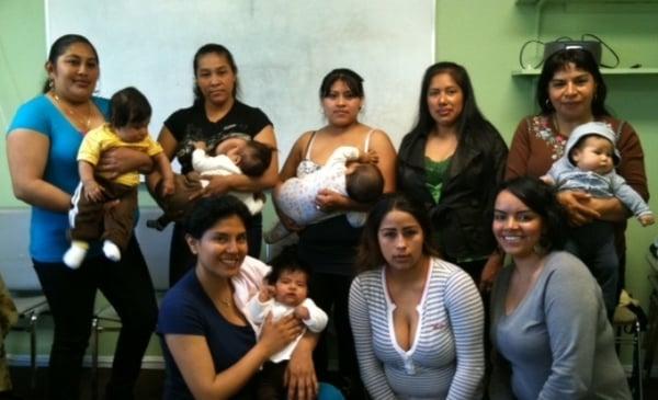 Parenting class group photo of mothers with their babies.