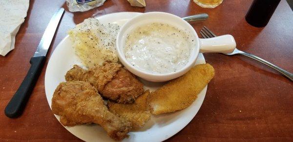 Fried chicken and catfish, mashed potatoes with gravy and extra gravy. Yum!