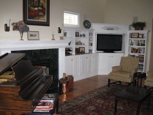 living room mantle and built in cabinet combo