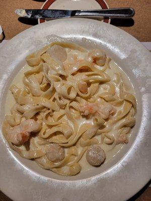 Fetuccini alfredo with scallops and shrimp.